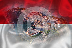 Monaco. Prince palace and old town on the rock in Monaco on Monegian flag overlay view