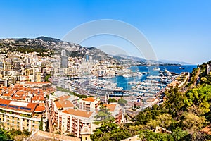 Monaco skyline view of the Hercules port with buildings roof tops and multiple yachts on the Cote d`Azur French riviera