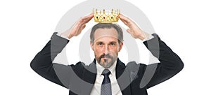 Monarchy family traditions. Man nature bearded guy in suit hold golden crown symbol of monarchy. Direct line to throne photo