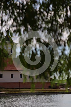 Monastery by the lake and weeping willow