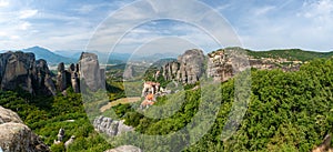 Monastery Meteora Greece. Stunning summer panoramic landscape. View at mountains and green forest against epic blue sky with