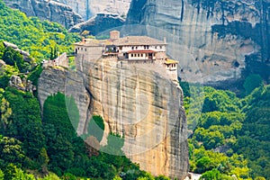 Monastery Meteora Greece. Stunning summer panoramic landscape. View at mountains and green forest against epic blue sky with