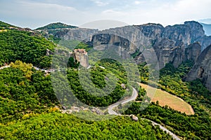 Monastery Meteora Greece. Stunning summer panoramic landscape. View at mountains and green forest against epic blue sky with