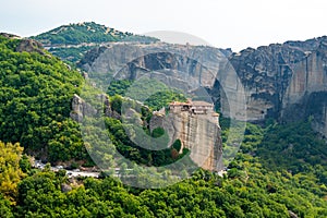 Monastery Meteora Greece. Stunning summer panoramic landscape. View at mountains and green forest against epic blue sky with