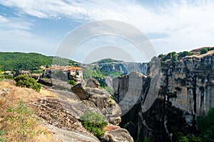 Monastery Meteora Greece. Stunning summer panoramic landscape. View at mountains and green forest against epic blue sky with