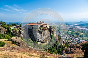 Monastery Meteora Greece. Stunning summer panoramic landscape. View at mountains and green forest against epic blue sky with