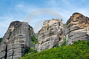 Monastery Meteora Greece. Stunning summer panoramic landscape. View at mountains and green forest against epic blue sky with