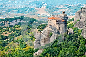 Monastery Meteora Greece. Stunning summer panoramic landscape. View at mountains and green forest against epic blue sky with