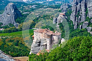Monastery Meteora Greece. Stunning summer panoramic landscape. View at mountains and green forest against epic blue sky with