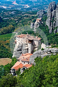 Monastery Meteora Greece. Stunning summer panoramic landscape. View at mountains and green forest against epic blue sky with