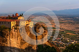 Monastery on a mountain and a city in Greece close up