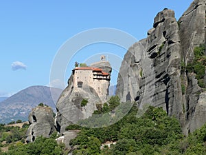 Monastery perched high up on the rocks in Meteora, Greece