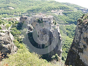 Monastery perched high up on the rocks in Meteora, Greece seen from above