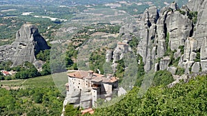 Monastery perched high up on the rocks in Meteora, Greece seen from above