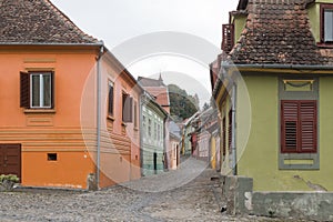 Monastery street in the castle of old city. Sighisoara city in Romania