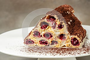 monastic cake with cherries on plate. Food recipe background. Close up