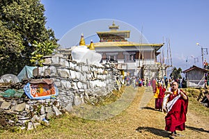 Monchs at the mani wall