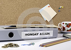 Monday Again - folder on white office desk