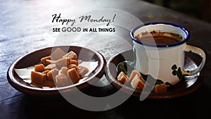 Monday inspirational quote - Happy Monday. See good in all things. With Java traditional cup of coffee and brown sugar on plate.