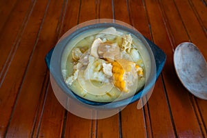 Mondongo soup in the typical kitchen environment with a spoon around it, preparation of Colombian food photo