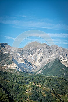 Moneta castle with Apuan Alps and Carrara marble quarries photo