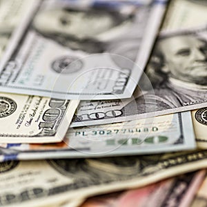 Money american hundred dollar bills.Closeup of assorted American banknotes.US currency scattered on the table.america currency