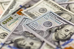 Money american hundred dollar bills.Closeup of assorted American banknotes.US currency scattered on the table.america currency