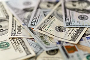 Money american hundred dollar bills.Closeup of assorted American banknotes.US currency scattered on the table.america currency