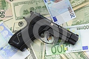 Money as a backdrop and a gun