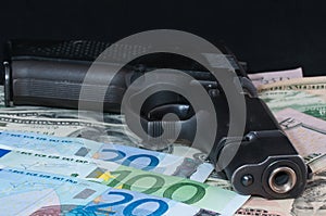 Money as a backdrop and a gun