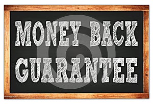 MONEY BACK GUARANTEE words on black wooden frame school blackboard