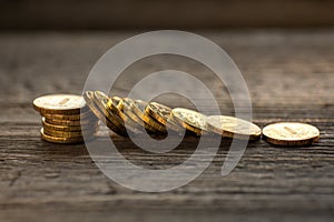 Money background, coins close-up scattered on a wooden table, the concept of savings, wealth, bank, deposits, taxes, gold