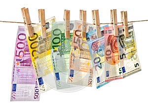 Money background. Euro banknotes hanging clothes pins