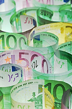 Money background - euro banknotes under lit