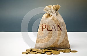 Money bag with coins and the word Plan. Personal financial planning concept. Management of the family budget. Savings and