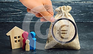 A money bag with a Euro sign and a family standing near the house. The concept of home buying. House rent. Buy housing in debt.