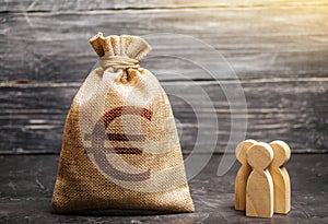 Money bag with a euro sign and people figurines. evaluation of the cost of the work of specialists and workers. concept