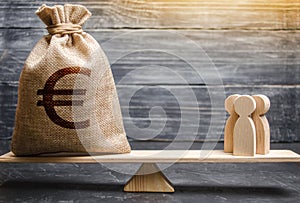 Money bag with a euro sign and people on the scales. evaluation of the cost of the work of specialists and workers. concept