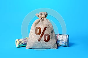 Money and a bag of interest. Official interest rates. Inflationary risks and regulation of the financial system. Deposit or loan.