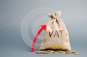 Money bag and red up arrow. The concept of increasing VAT tax. Tax burden on business consumers. VAT refund and double taxation