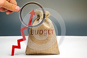 Money bag with the word Budget and an up arrow. Concept of business success, financial growth and wealth. Increase profits and