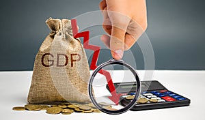 Money bag with the word GDP and down arrow. Decline and decrease of GDP - failure and breakdown of economy and finances leading to