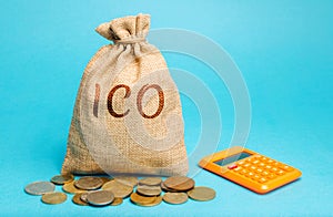 Money bag with the word ICO  Initial coin offering  and calculator. Attracting investments in the form of selling to investors a photo
