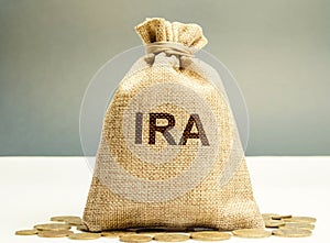 Money bag with the word IRA - individual retirement account. Tax-advantaged account that individuals use to save and invest for