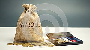 Money bag with the word Payroll and calculator. Payroll is the sum total of all compensation a business must pay to its employees