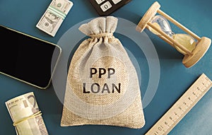 Money bag with the word PPP loan - Paycheck Protection Program. Loan designed to provide a direct incentive for small businesses