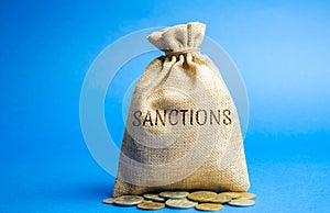 Money bag with the word Sanctions. The imposition of economic and political sanctions on the subjects of geopolitics. Restriction