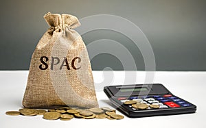 Money bag with the word SPAC - Special purpose acquisition company. Simplified listing of company, merger bypassing stock exchange