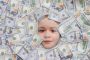Money banknotes, cash dollars bills. Kids how to be rich. Child with dollar bills near face. Financial independence and