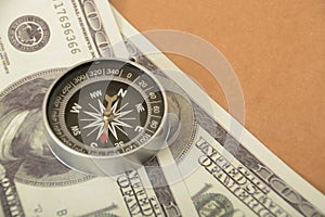 Money banknotes and compass.Navigating Wealth: Money Banknotes as a Compass to Financial Success